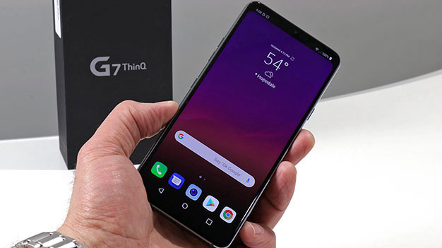 LG G7 ThinQ in hand with box