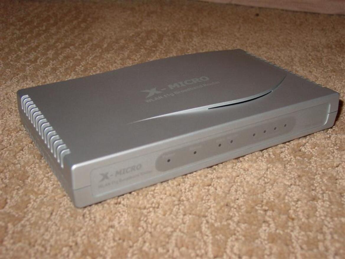 X-Micro WLAN 11g Turbo Mode Broadband Router and PCMCIA card