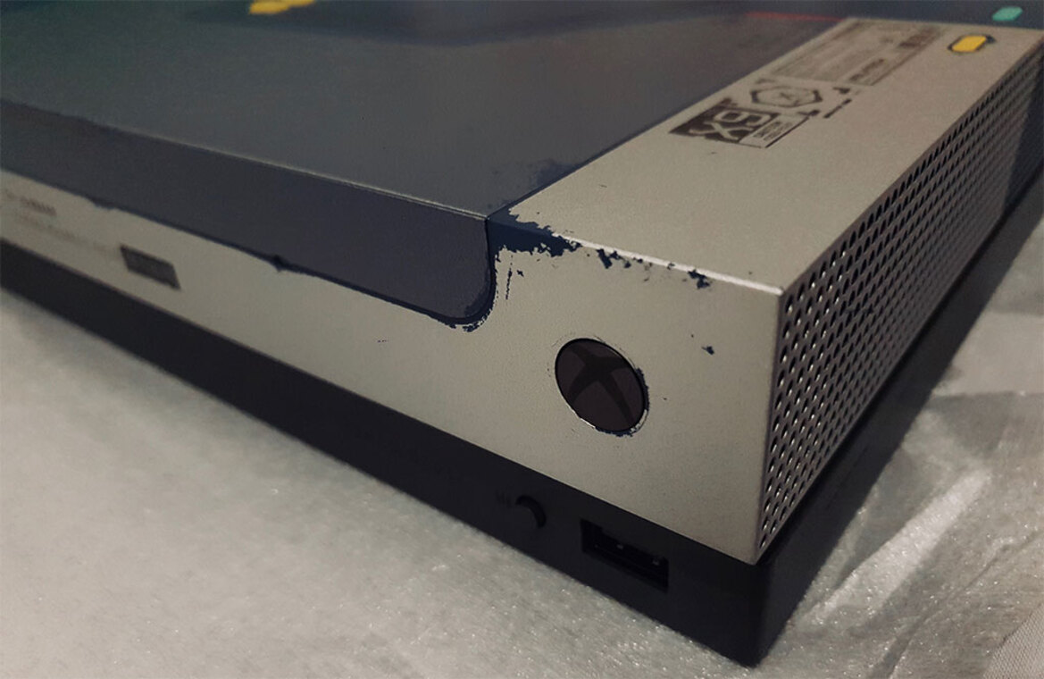 Xbox One X Cyberpunk 2077 Edition Console Stars In A Photo Shoot Looking Rough And Ready